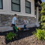 Custom Steel Window Well Cover with kids playing on it - Mountainland Covers 
